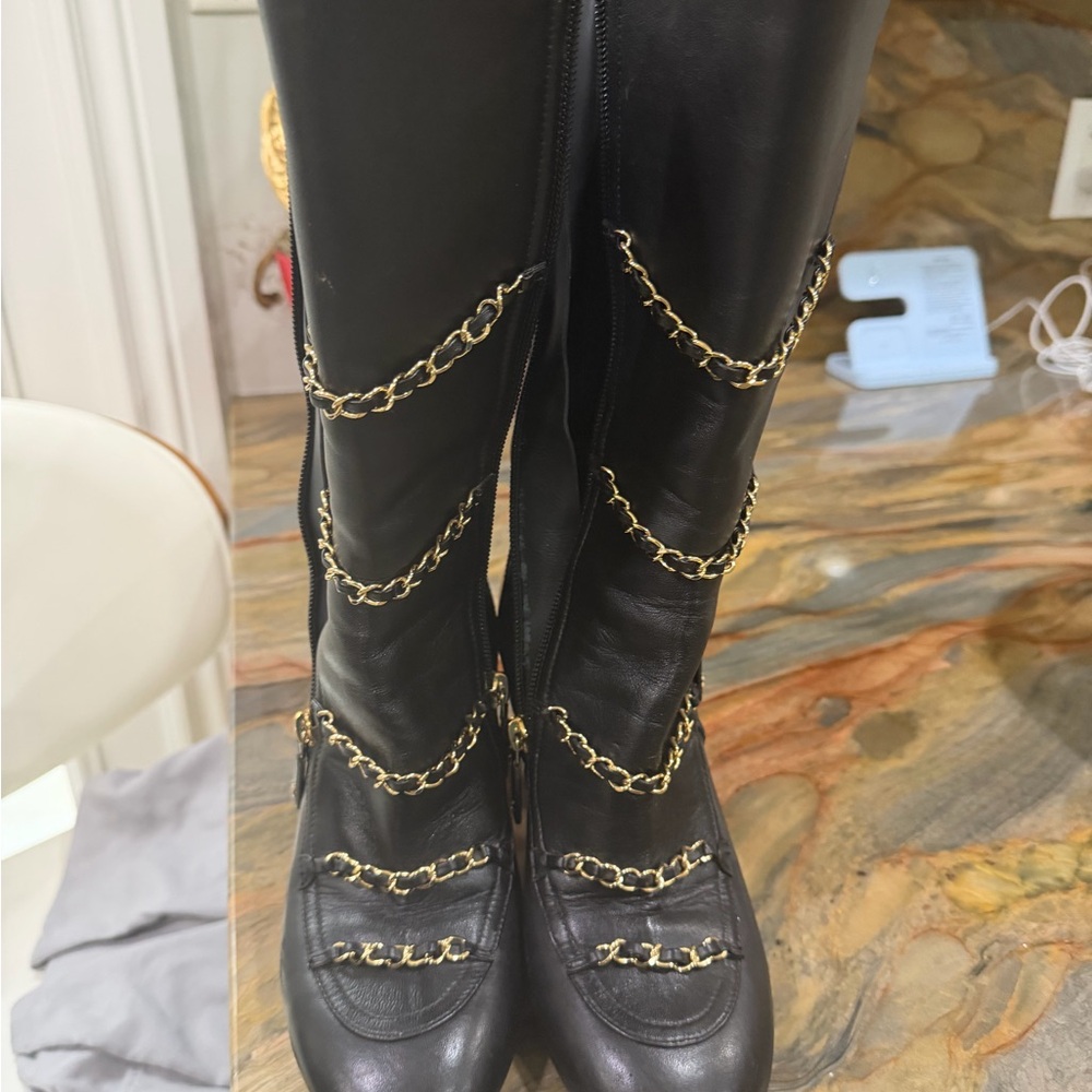 CHANEL Black Quilted Heeled Boots with Gold Accents- 37.5